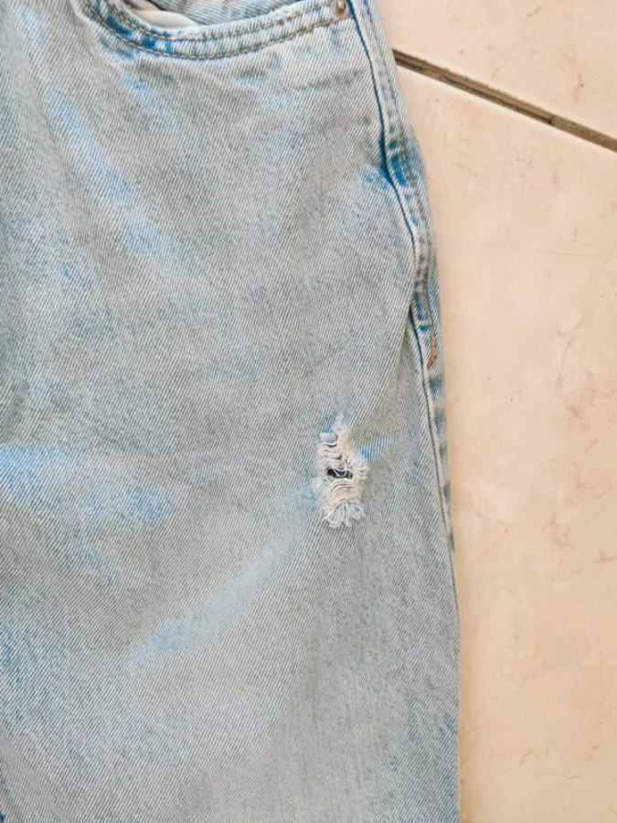 Illustration de Jeans grunge déchiré Stradivarius